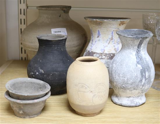 A group of Chinese pigment painted pottery vessels and a sgraffito jar, Neolithic or later